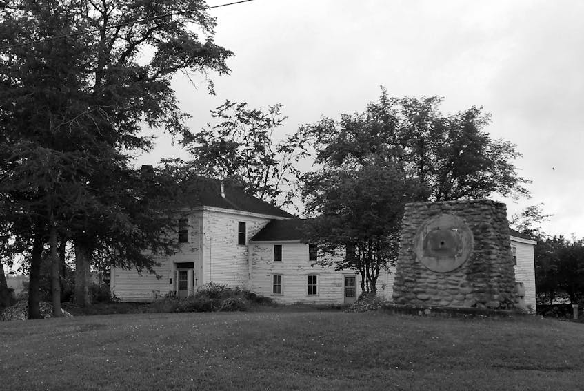 The Amos Thomas Seaman House in Minudie with a monument to the grindstone industry established by his father.