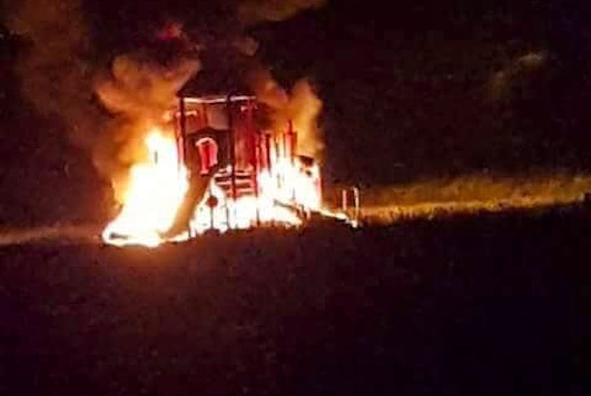 Playground equipment burns on Mechanic Street in Springhill late Friday night. RCMP are seeking the public's attendance in locating those responsible.