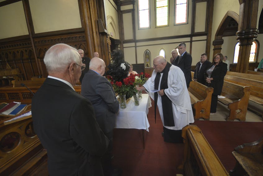 Roses remembering lives lost to mining coal in Springhill were arranged by Rev. Dr. Brian Spence under the watch of Nova Scotia Premier Stephen McNeil during the community’s Miners Memorial Day service June 11.