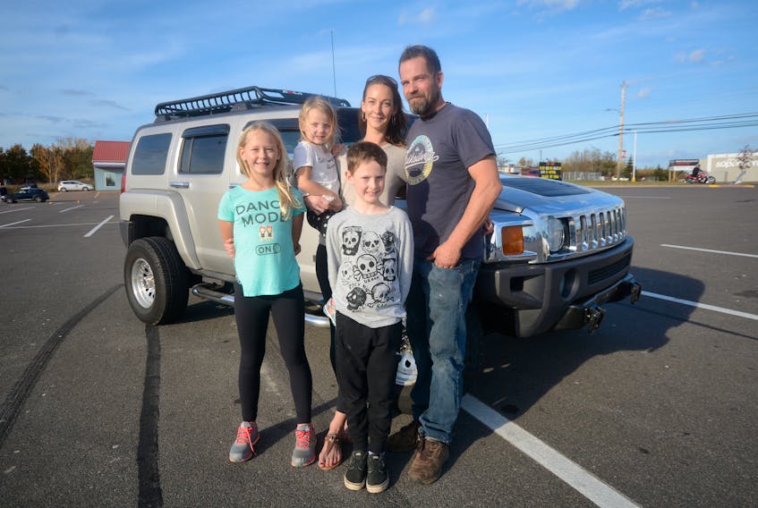 Posting his pleas for help to Facebook paid off for Colin Smith. He was reunited with his stolen Hummer on Monday in Halifax after it was stolen from his home in Amherst. Smith's family, including the Hummer, stopped by the Amherst Town Square Mall for a family photo Tuesday afternoon. Parents Megan and Colin Smith, are joined by three of their four children: (from left), 10-year-old Moira Embree, three-year-old Quinn Smith, and nine-year-old Rowan Embree.