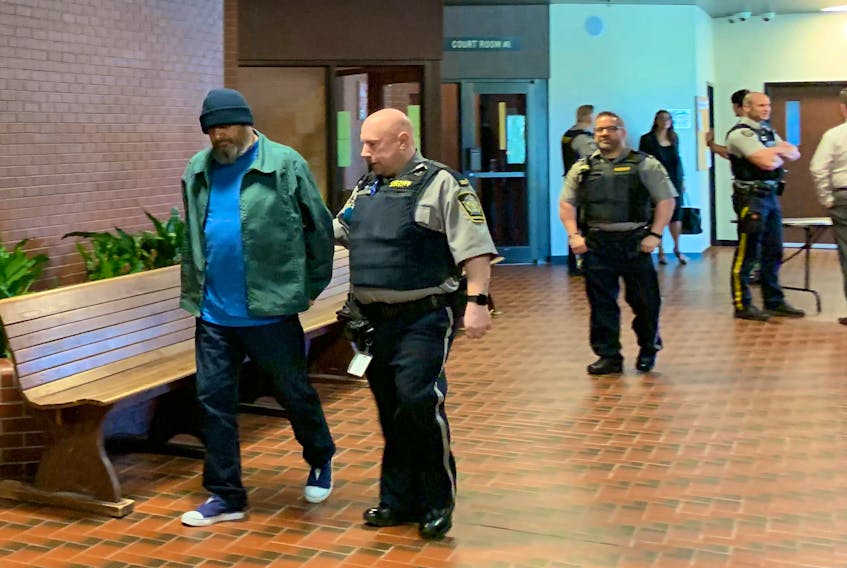 Darrin Rouse is led into Kentville supreme court in May 2019. The Nova Scotia Court of Appeal has rejected Rouse's appeal of a 2018 conviction for trading prescription drugs for sex.