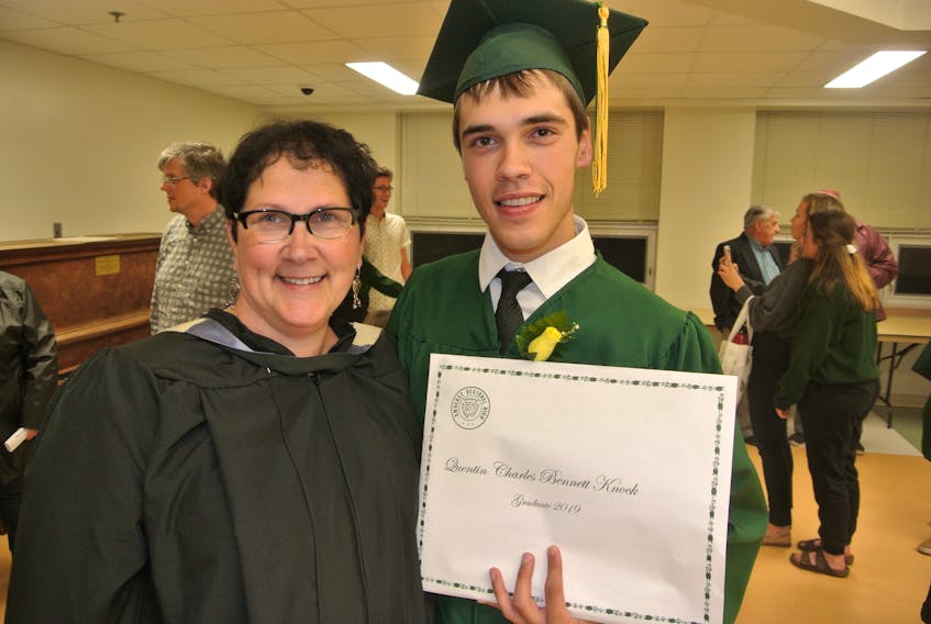 ARHS teacher Vanessa Knock congratulates her son, Quentin, during graduation ceremonies at the school on June 27. Quentin received numerous awards and scholarships including the Jordan Boyd Leadership Award and Scholarship valued at $2,000.
