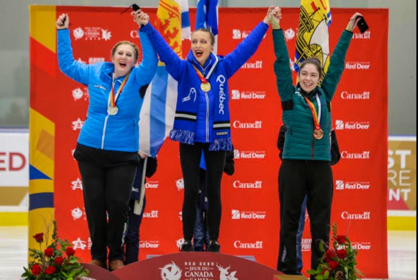 Jessica Cranton, left, celebrates with her fellow medallists for the Special Olympics Singles Level III Female competition on Feb. 28 at the Gary W. Harris Canada Games Centre in Red Deer, Alta. Len Wagg Photo, Communications NS