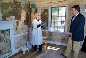 Conservator Ann Shaftel was brought in to uncover an extensive mural under the wallpaper in an upstairs room at Annapolis Royal’s Sinclair Inn Museum in the summer of 2016. West Nova MP toured the museum and even helped Shaftel gently scrape away the moistened wallpaper using a scalpel. He’ll be back on May 15 for the Painted Room’s official opening.
