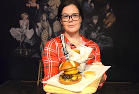 Michelle Friel, chef and kitchen manager at the Capitol Pub shows off her ‘Southern Charm’ creation that will be the Middleton pub’s entry in the fourth annual Burger Wars, a fundraiser for Campaign for Kids. This year 47 restaurants, pubs, and taprooms in the Annapolis Valley and beyond have entered the competition that supports children in need. Friel’s ‘Capitol Double Down’ won the Burger Wars competition last year.