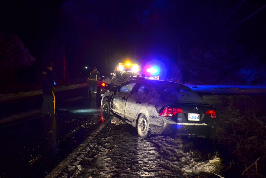 This Honda Civic slid into the ditch in Brickton just east of Lawrencetown Wednesday evening (Dec. 13) just after 7 p.m. Temperatures dropped to freezing and snow was falling, making road suddenly treacherous.