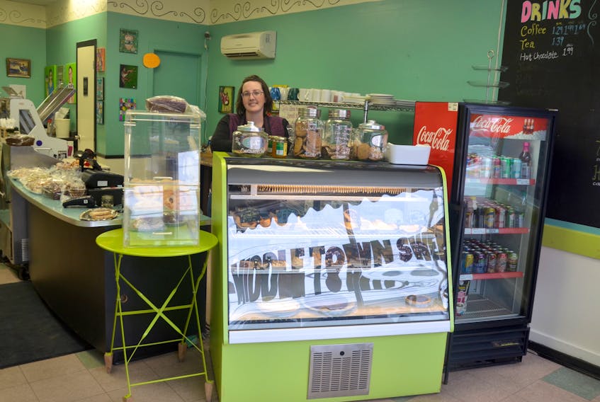Erica Pretzlaw stands behind the display counter at Middletown Sweets where she serves a regular clientele her popular baked goods and daily lunches. A recent building improvement project has Pretzlaw closing up shop and looking for a new space.