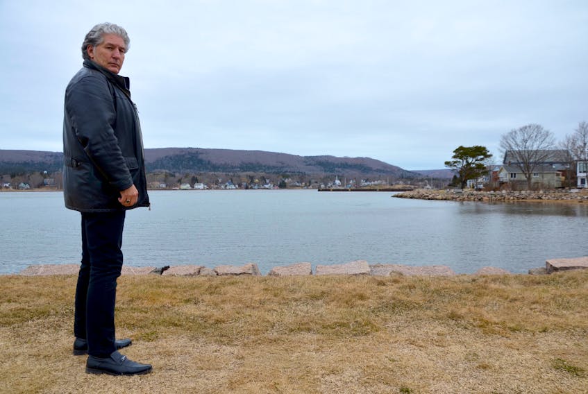 Annapolis Royal Mayor Bill MacDonald stands on the old wharf below Fort Anne. If sea level rise projections are even close to being accurate, the historic structure could be routinely under water before the end of the century. It would be just the first of local built heritage to be affected. The town is preparing to tackle the issue of sea level rise and other environmental concerns.