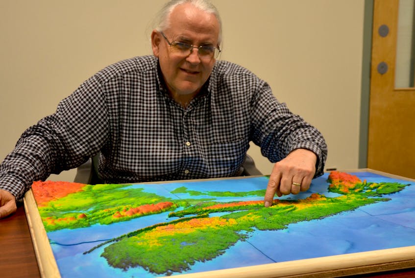 Dr. Tim Webster points to a 3-D map of Nova Scotia. Sea level rise will affect many communities over the next century. The research scientist with the Applied Geomatics Research Group at the NSCC Annapolis Valley Campus, Middleton charts coastline elevations using LiDAR (Light Detection and Ranging) and creates maps overlaid with sea level rise projections, high tides, and storm surge numbers to show where flooding will occur.
