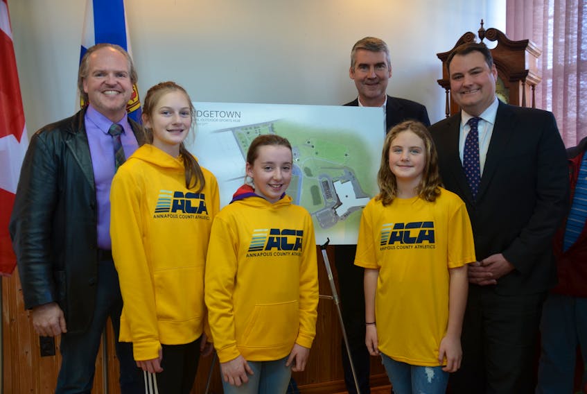 Annapolis County Warden Timothy Habinski, Nova Scotia Premier Stephen McNeil, and West Nova MP Colin Fraser announced a new $3.5-million new athletics complex for Bridgetown Dec. 20. Several young track athletes were on hand for the event. The outdoors facility will be built on the site of the former Bridgetown Regional High School.