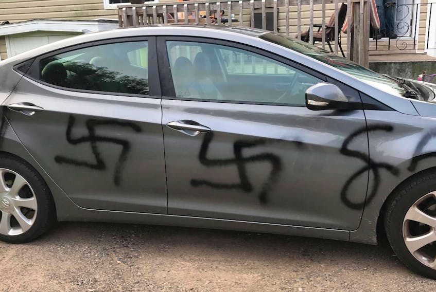 A Middleton woman woke up Aug. 22 to find somebody had spray painted swastikas and dollar signs on her new car. Police are investigating and asking members of the public to call them if they have any information.