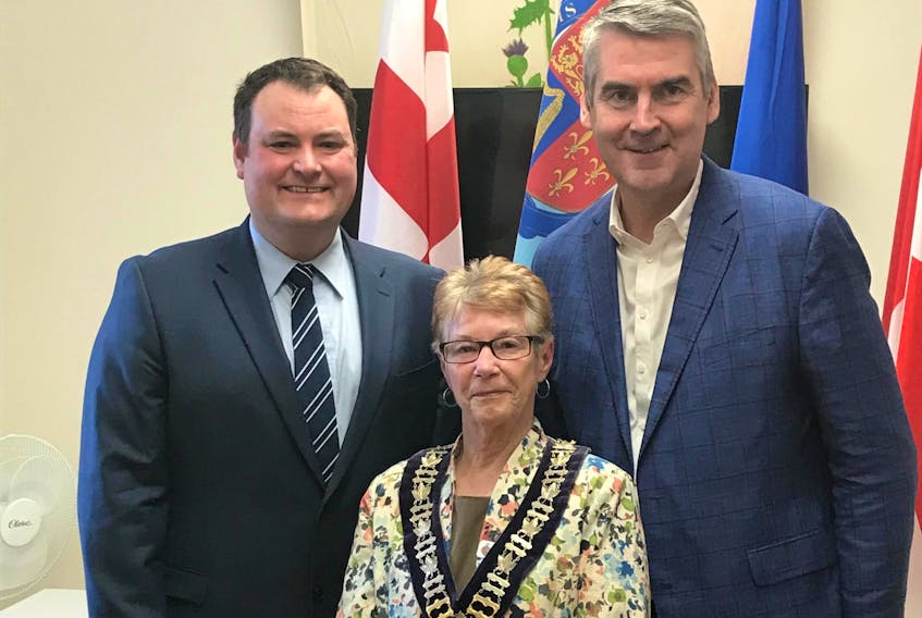 West Nova MP Colin Fraser, Annapolis Royal Deputy Mayor Pat Power, and Nova Scotia Premier Stephen McNeil announced funds April 23 for a $350,000 that will put a roof on the farm market and convert an old bus garage into public washrooms and a retail space.