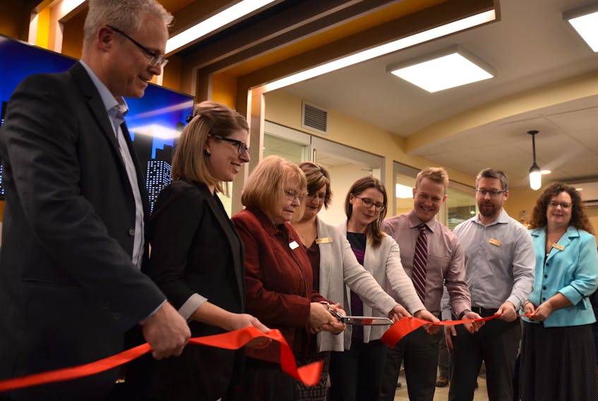 The new Valley Credit Union branch office in Bridgetown was officially opened on Jan. 24 with the local staff cutting the ribbon. At left is Valley Credit Union president and CEO Len Ells.