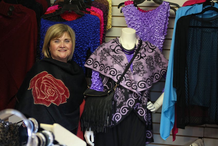Hidden Valley Treasures owner-operator Melanie Salisbury with some of the unique pieces of ladies' clothing available in her new clothing boutique located at 87 Commercial Street in Middleton. Salisbury also plans to have men's clothing for sale, as well as a 'curvy' women's line.