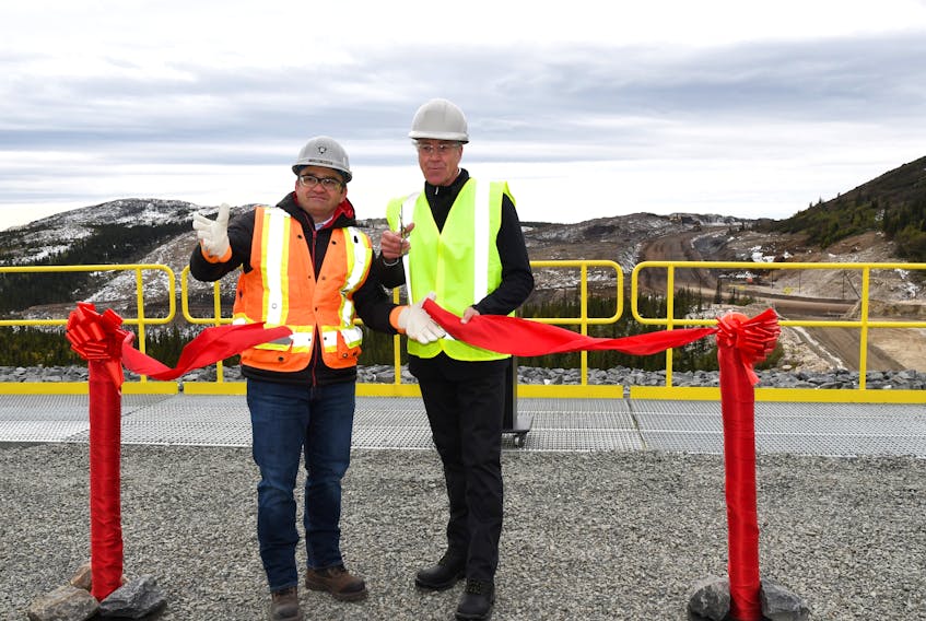 IOC CEO and President Clayton Walker (left) and Premier Dwight Ball cut the ribbon to open 'The Moss Pit,' the company’s newest mining endeavour in Labrador West.