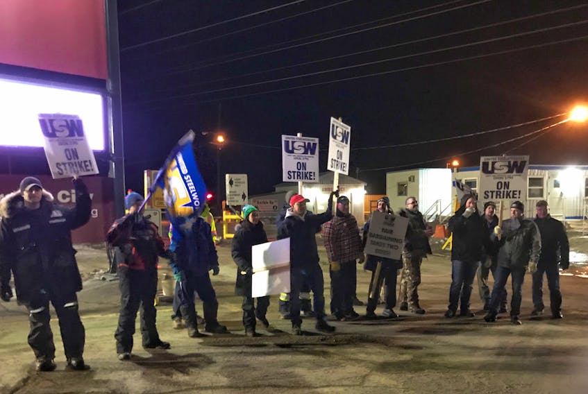 Steelworkers at IOC on picket line just after midnight Monday. The contract offer was rejected by 92 per cent.