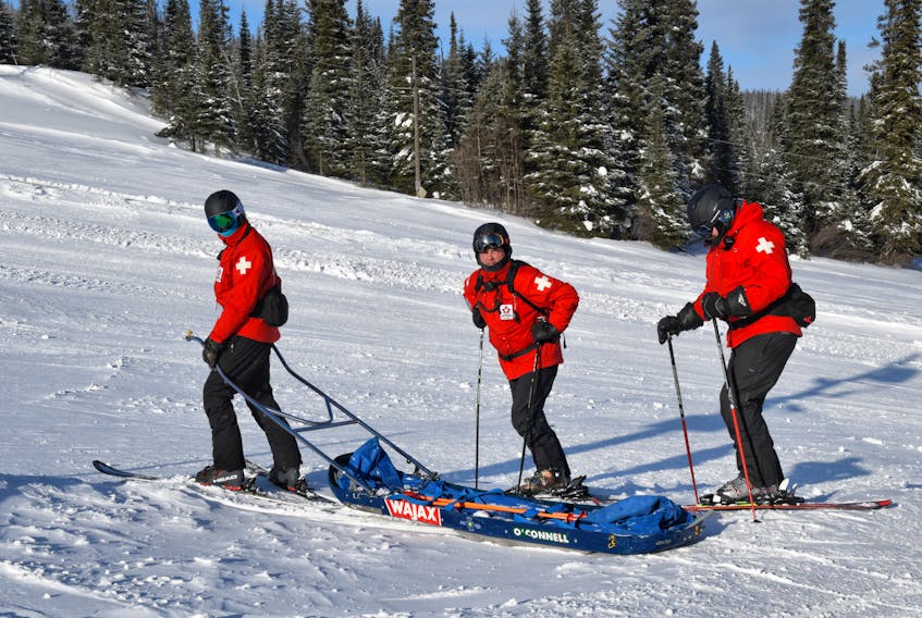 Jonathon Rivière, Jim Dobbin and Matt Garvin prepare for on snow training