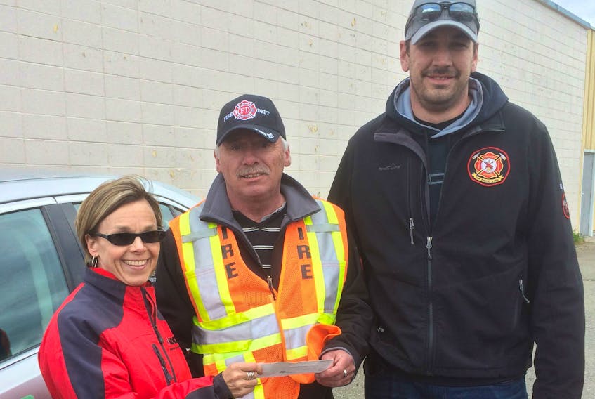 The Labrador City Fire Department made a presentation to the MADD Labrador West chapter at last year’s motorcade. Pictured (from left) MADD member Josephine Gaulton-Rowe, Fire Chief Joe Power and volunteer firefighter Bryan Fagan.