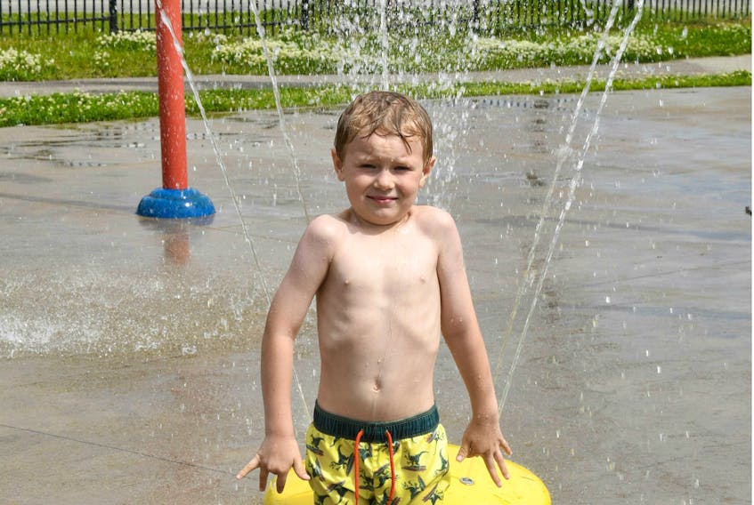 Sloan Powell of Labrador City says the splash park at Centennial playground is the perfect way to beat hot humid days.