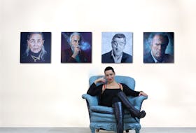 Angela Hardy in front of her artwork.