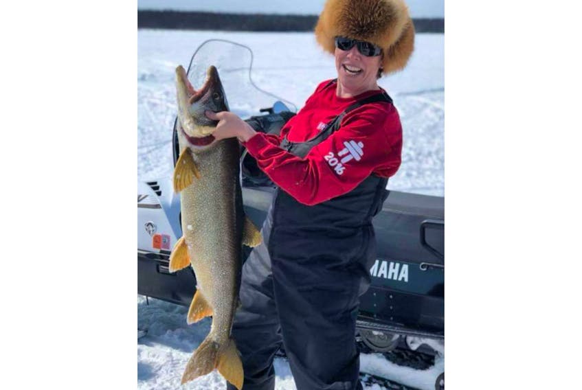 Bernadette Wheaton with a 21 lb lake trout.