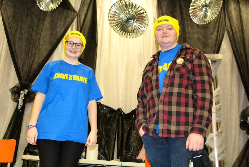 Emily Kavanagh and Texas Johnson, students at Menihek High School in Labrador City, shaved their heads on April 1 to raise money for cancer research.