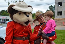 14-month-old Britton Schroeder meets the RCMP Safety Bear and Const. Jennifer Britton at an open house held at the new Kings District RCMP headquarters in New Minas. KIRK STARRATT