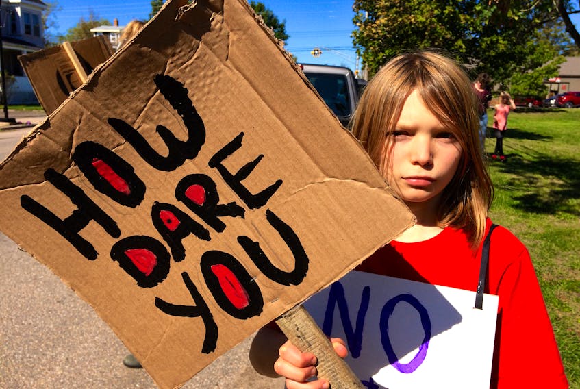 Sixteen-year-old Swedish climate crisis activist Greta Thunberg said to world leaders: “How Dare You?” The phrase has become a youth slogan across the globe as young people demand action from politicians to halt climate change. This sign was seen at a climate strike and rally in Middleton Sept. 27.