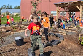 Glooscap Elementary students jump on tires installed as part of an outdoor classroom, which was officially opened Sept. 27. ANITA FLOWERS