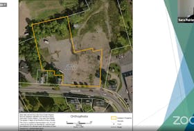 Planner Sara Poirier presented this 2013 Windsor orthophoto to show the property in question — 543 O’Brien St. and what abuts it. The property is owned by developer Clark A. Wilkins and he wants to create a gas bar and restaurant at the site. The buildings at 573 and 575 on O’Brien Street are no longer standing.