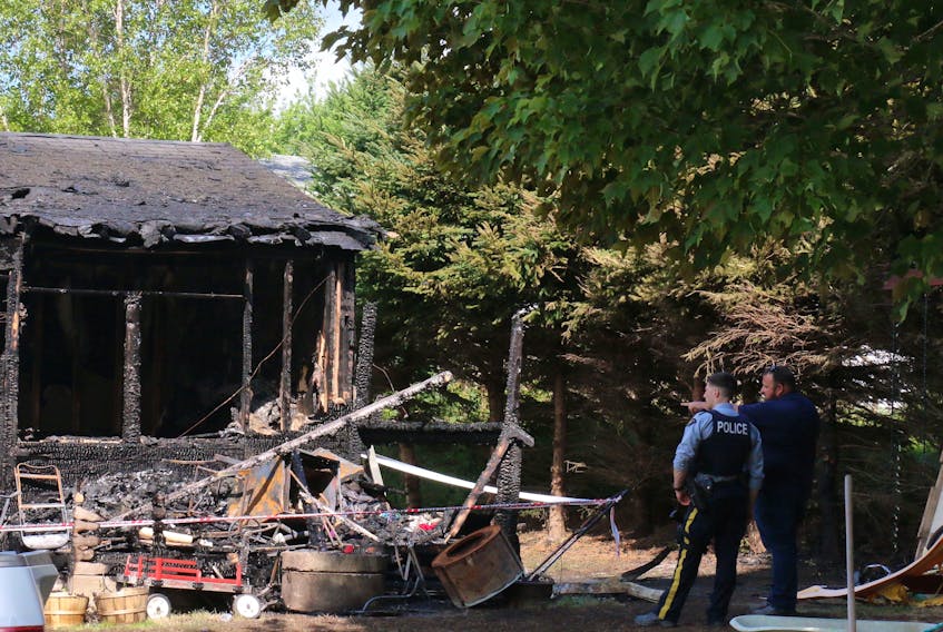 An RCMP officer was still at the scene of a house fire around 11 a.m. Aug. 6. The residential home, located in the 300 block of Panuke Road, caught fire shortly before 3:45 a.m.