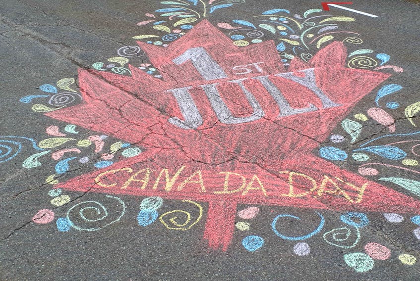 Cathy Dunbar used chalk to help decorate the end of her street in time for Canada Day and her husband, Ian, helped decorate the lawn with flags and whirligigs. The artistic effort paid off as the Dunbars placed first in the HMCC July 1 home decorating competition. CONTRIBUTED