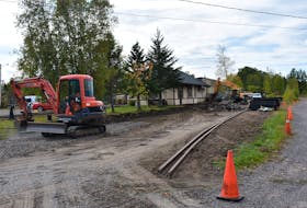 Passersby were keen to see what workers were up to at the old train station in Middleton on Oct. 5.