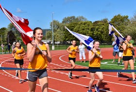 Runners with Annapolis County Athletics complete the ceremonial first lap during the official opening of the Bridgetown Regional Outdoor Sport Hub Park on Sept. 4.