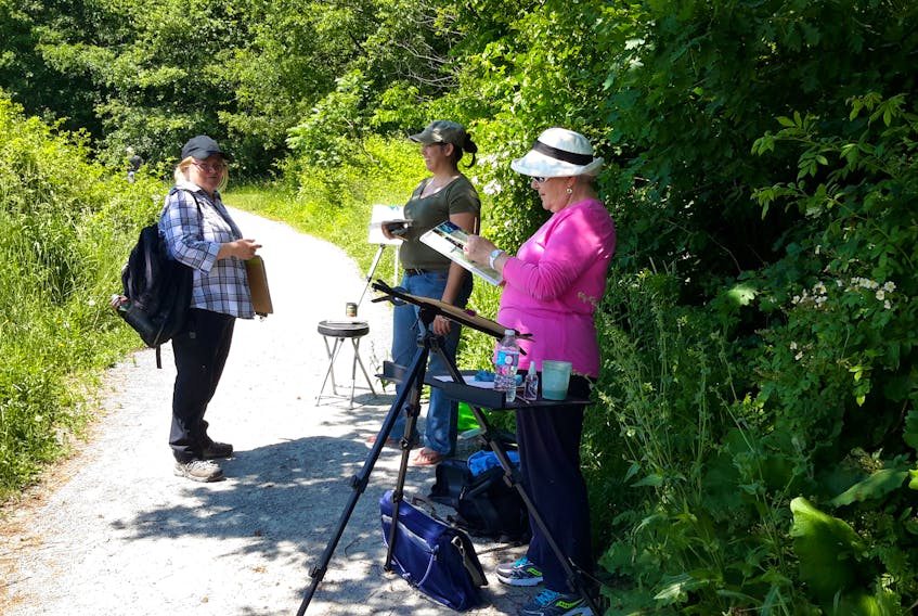 Artists set their paintings out to dry in the sun at a previous Plein Air Art session at Miner’s Marsh in Kentville.