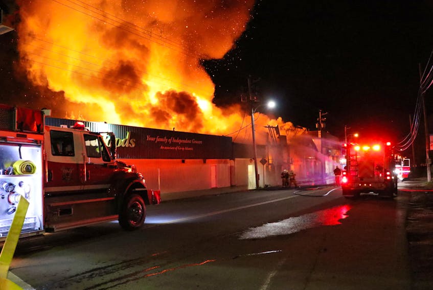 Firefighters from several departments throughout Kings County rallied together in the early-morning hours Sunday to battle a fast-moving fire that spread to multiple buildings in downtown Canning. ADRIAN JOHNSTONE PHOTOS