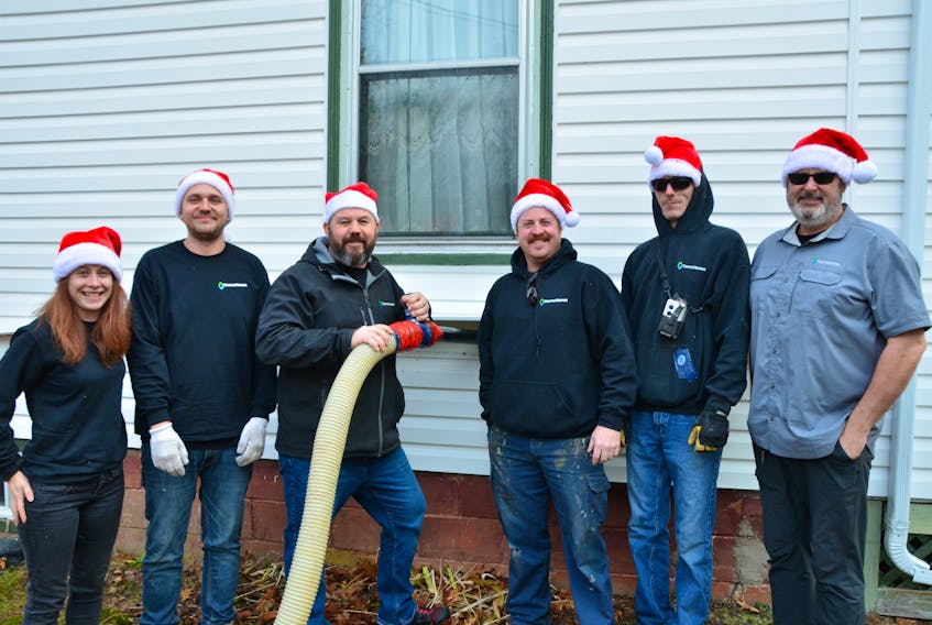 Meghan Somerville, Sean Dorey, Dave Brake, Chris Beaver, Jason Gillis, Dwayne Jones and others from Thermo Homes in Kentville warmed a Steam Mill woman’s heart and home this holiday season.
