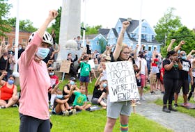 Hundreds of people converged on Victoria Park in Windsor to protest the systemic racism against people of colour June 13.