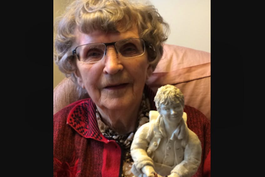 The late Elfriede Meindl, a former resident of the Middleton area and Bridgetown, holds one of her big figurines of "Christopher," a character she created for her children's books.