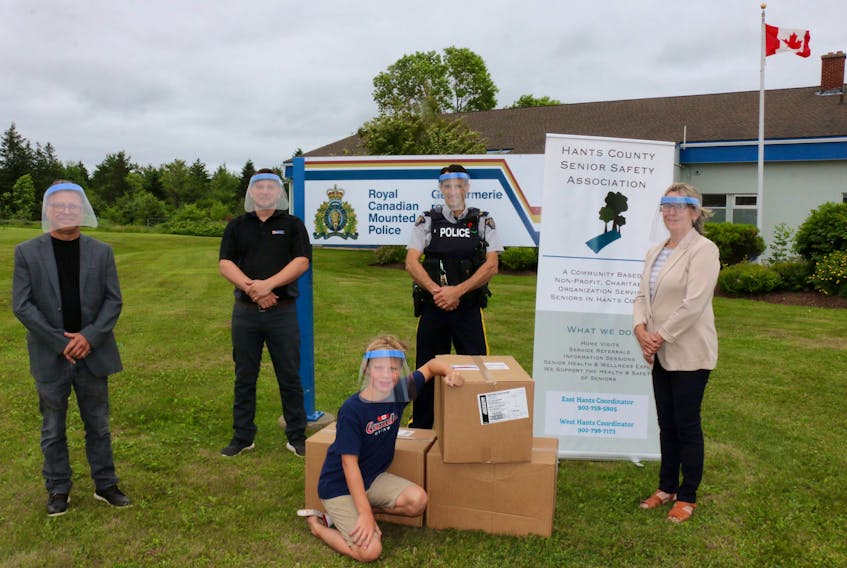The Hants County Senior Safety Association received a donation of 200 face shields July 15 thanks to SureWerx and PartSource. Pictured here are, from left, Brian Slaunwhite, area sales manager for PartSource — a distributor of SureWerx; Nick Crowe, territory account manager for SureWerx’s Atlantic Canada chapter; his son, Luke Crowe (seated); RCMP Staff Sgt. Cory Bushell, an advisor with the Hants County Senior Safety Association; and Karen Crowe, the senior safety co-ordinator for the Hants County Senior Safety Association.