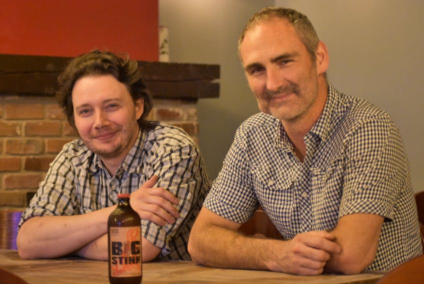 Roof Hound Brewing Co. co-owners Ben Boysen and Les Barr sit inside the soon-to-be open Kingston location at 573 Main Street.