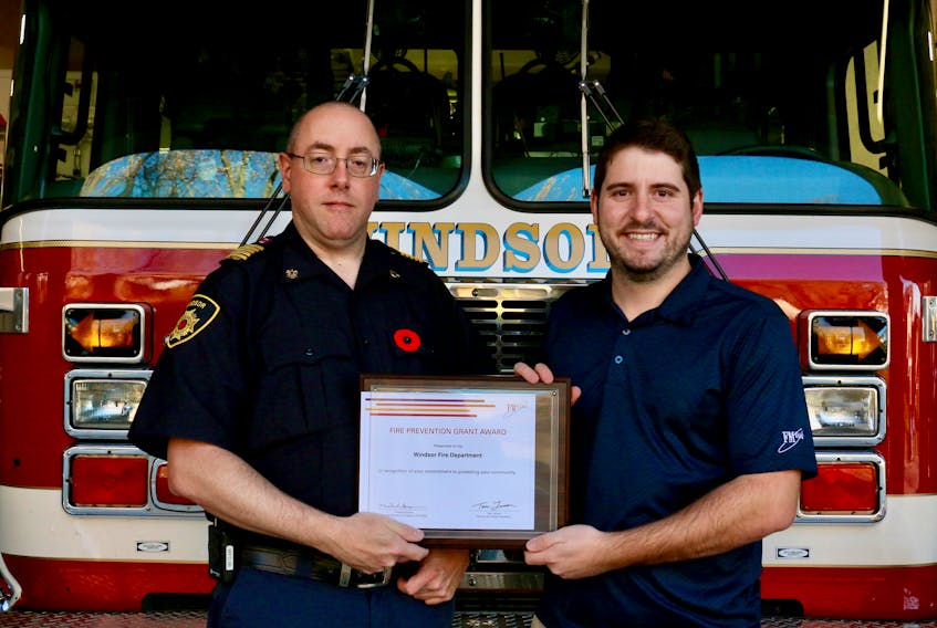 Vincent Tremblay, a consultant engineer with the Montreal branch of FM Global, right, recently presented Windsor fire Chief Jamie Juteau with a fire prevention grant valued at US $1,650.
