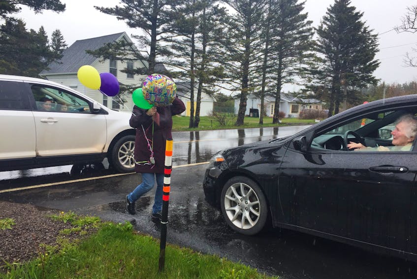 Margaretville resident Millie Banks parked at the end of her driveway on her 90th birthday and was treated to a long drive-by parade held in her honour on May 16.