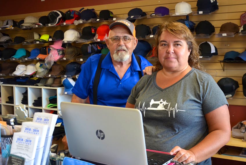 Amy Evans and her father Charles Bent were at Amy’s Embroidery Friday morning Aug. 16 to assess the damage and to check the inventory after somebody smashed the front door, grabbed some cash boxes, and fled out the back. The break-in happened in the wee hours of Aug. 14 when Evans was in Ontario.