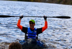 Kevin Walsh reacts as he makes it across Lake Pisiquid to secure a first-place finish at the annual pumpkin regatta. It was his third time competing.