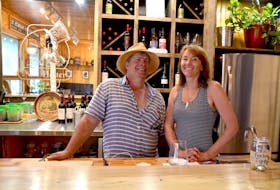 Paul and Holly Sanford in their Mad Hatter Wine Bar at the bottom of St. George Street in Annapolis Royal. Paul Sanford was a fisherman for 43 years. He came ashore for good in April and went to work on the bar that opened recently.