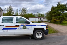 An RCMP truck is shown outside of a Ridge Road property in Melanson on Tuesday. Area residents say multiple RCMP units have visited the trailer as part of an investigation that began on the weekend.