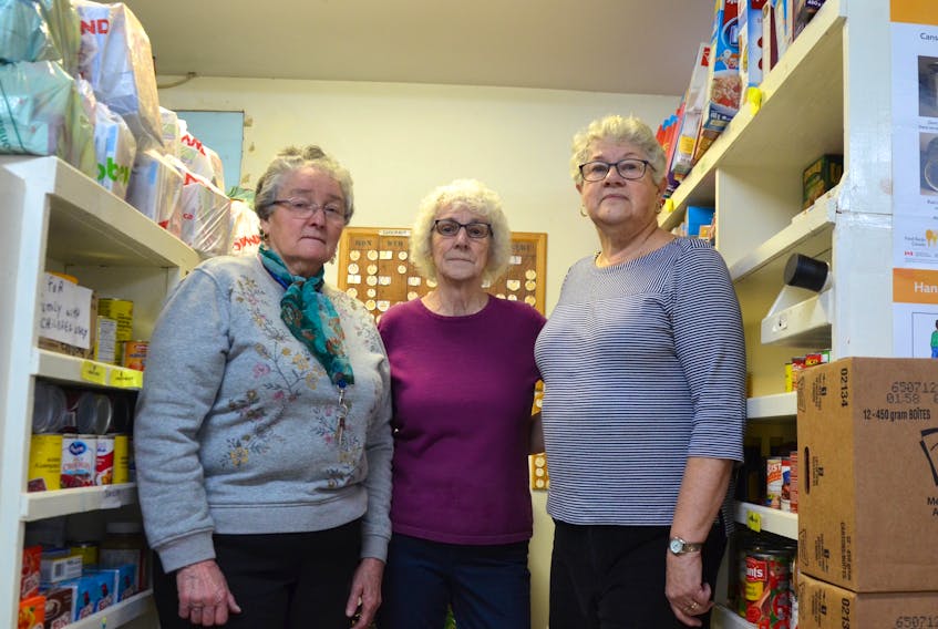 Twelve Baskets Food Bank manager Joan Morrison, left, and volunteers Cecile Demolitor and Rosa Pothier were the first on the scene after a thief of thieves broke into the building the night of Dec. 16 and made off with food intended for hungry local families.
