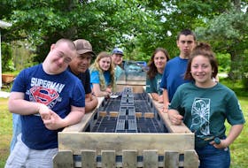 4-H members in the Annapolis Valley and their counterparts in Saskatchewan took part in a community project at Melvern Square at Outside the Box Skills Program Society recently. They created a raised garden for the Outside the Box members. From left are Nick, John, Alexandra, Kade, Jayne, Liam, and Hailey. The 4-Hers were part of a summer exchange program.