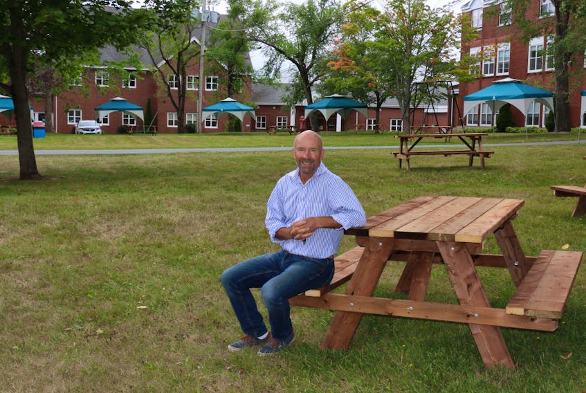 Joe Seagram, the headmaster of King’s-Edgehill School in Windsor, is preparing to welcome boarding and day school students back to the private campus. In order to lessen the chance of catching COVID-19, the school is providing outdoor classroom space, as well as encouraging more outdoor activities. Multiple picnic tables have been set up throughout the 75-acre property.